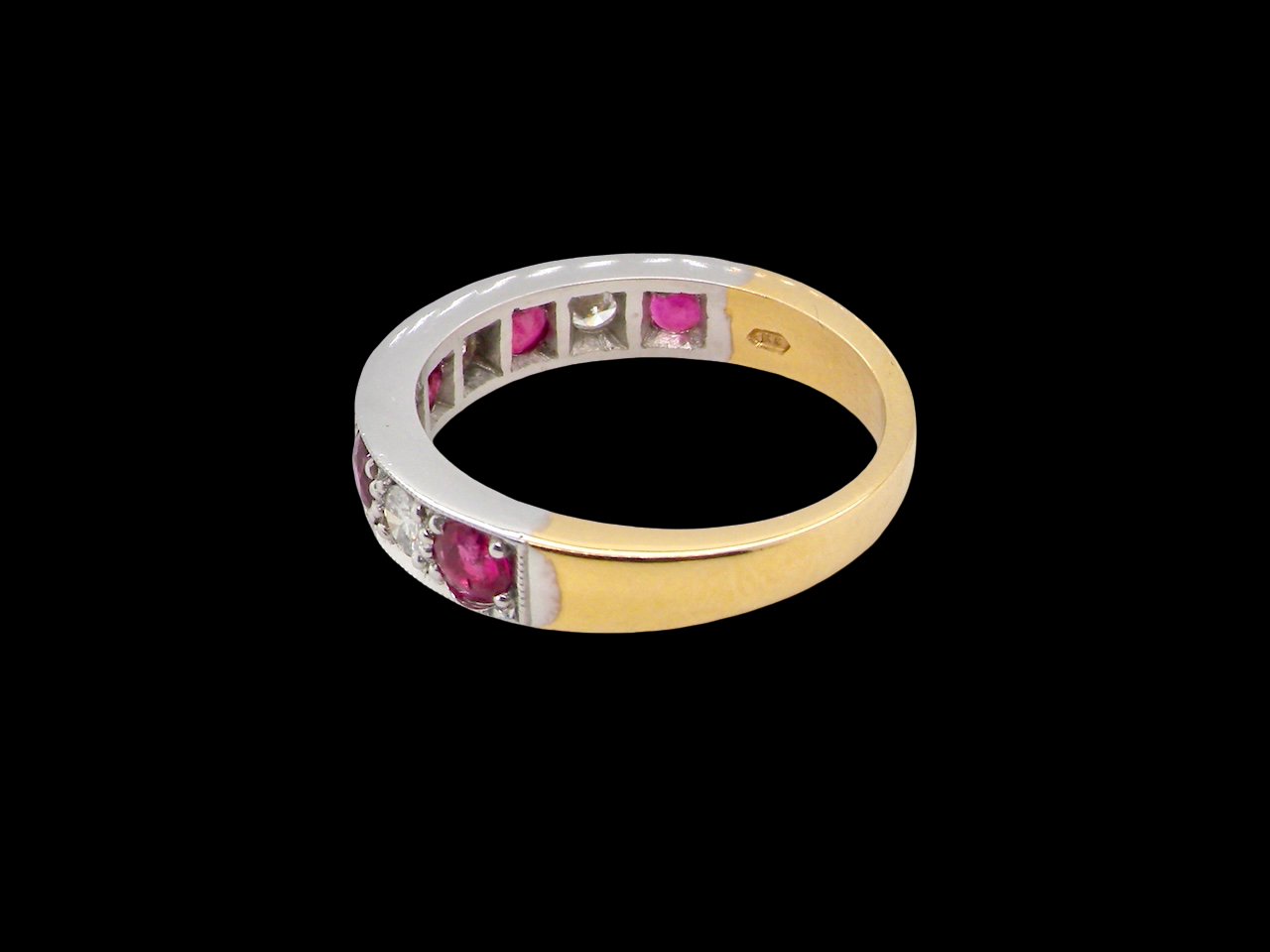 rear beautifully crafted 18 carat gold half-hoop eternity ring,