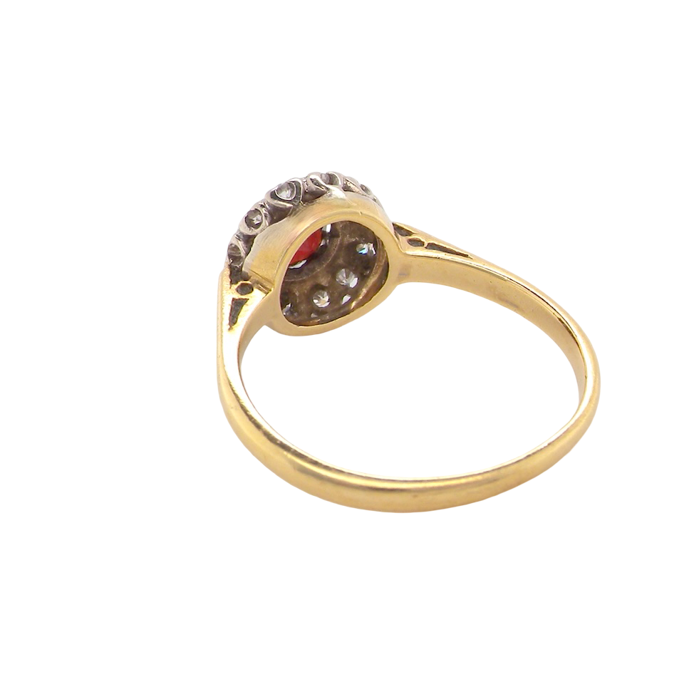 rear classic 1960s 18 carat yellow gold cluster ring, featuring a round garnet