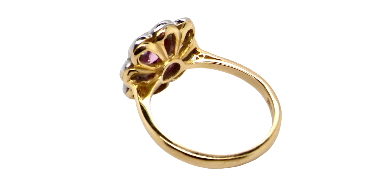 rear cluster ring featuring a beautiful cushion-cut pink sapphire