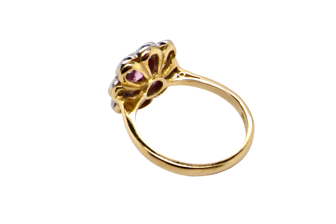 rear cluster ring featuring a beautiful cushion-cut pink sapphire
