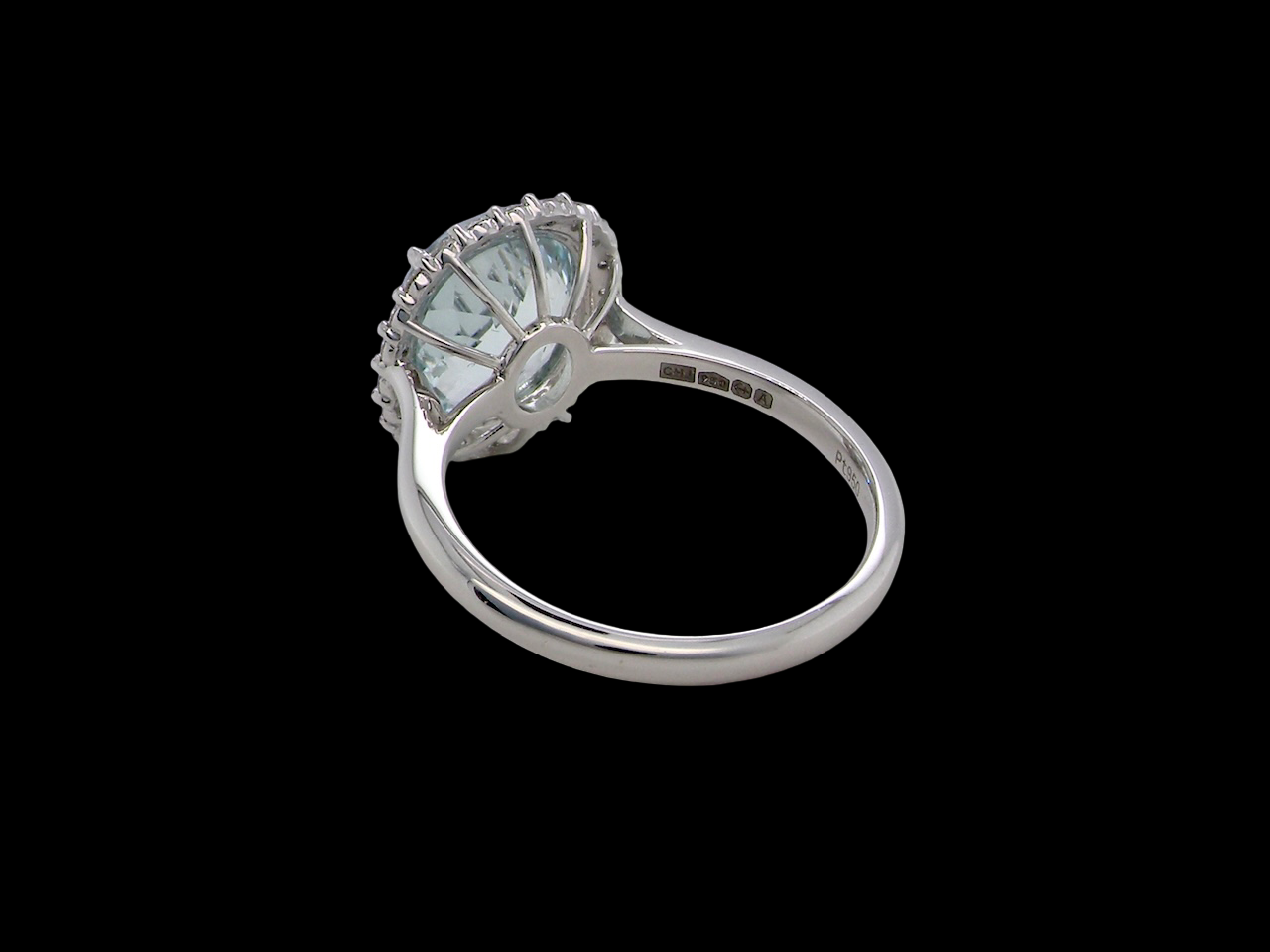 rear elegant cluster ring centred on a beautiful oval aquamarine,