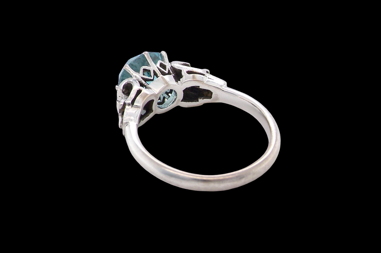 rear fine Art Deco ring that features a stunning natural blue zircon centre stone