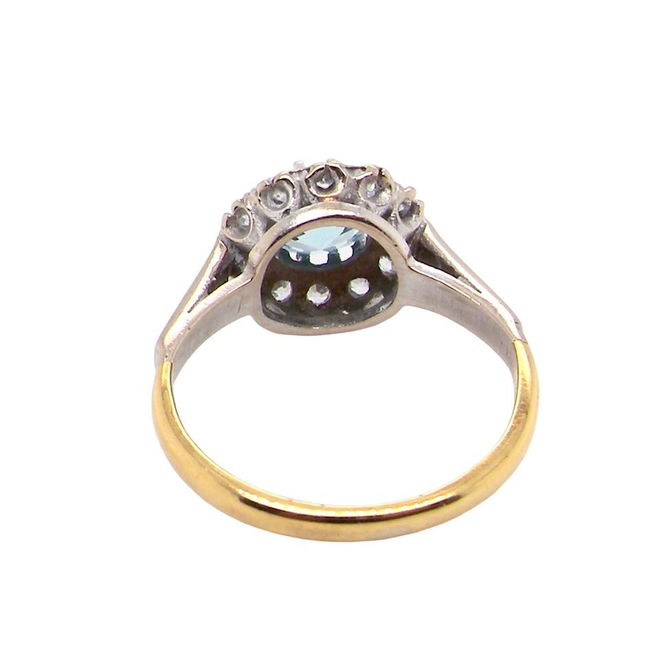 rear fine vintage cluster ring. The centre stone a natural blue zircon, 7mm diameter, bright sparkling refraction to the sky blue hue. 
