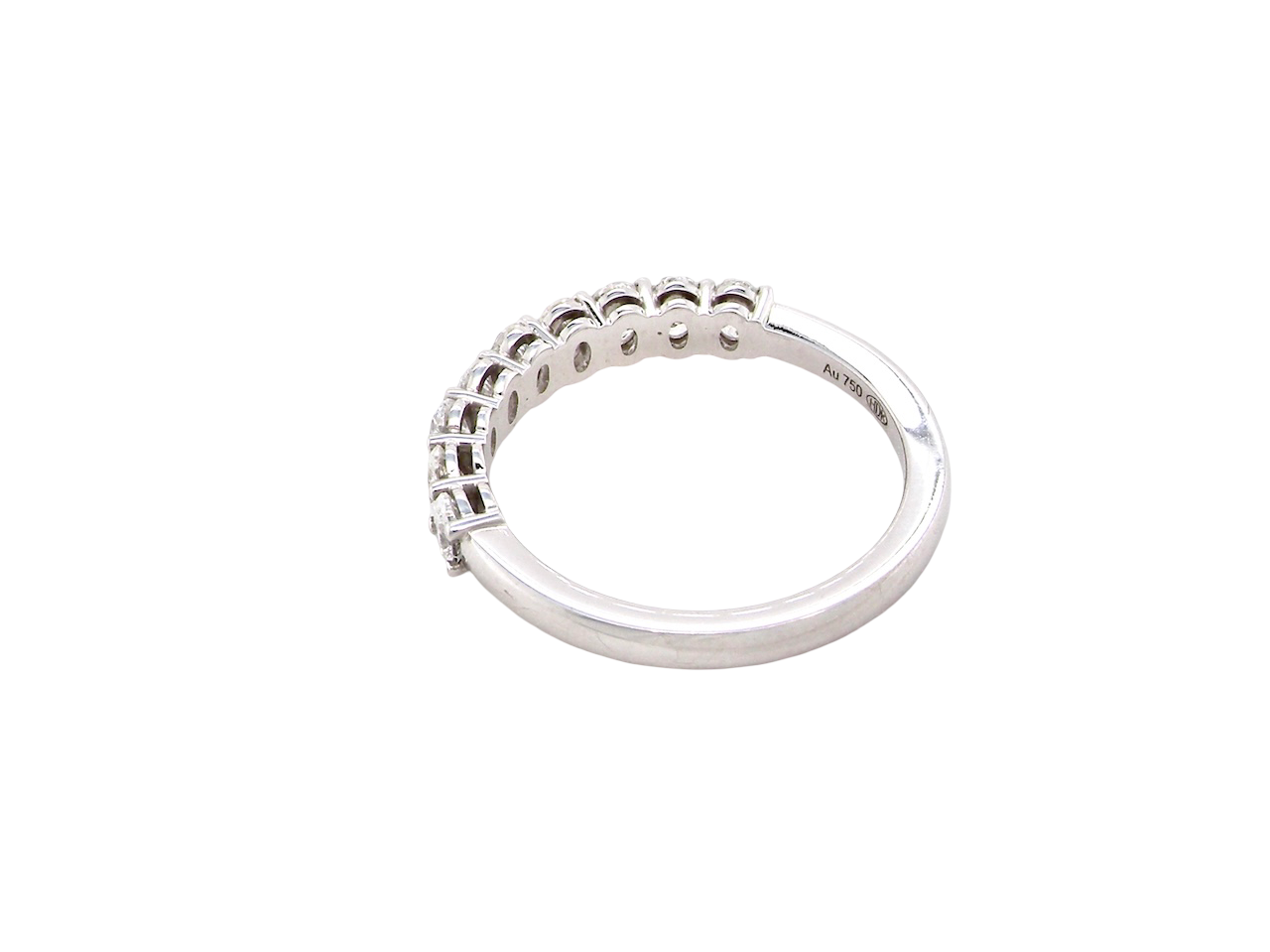 rear gorgeous half-hoop eternity ring set with nine oval brilliant-cut white diamonds.
