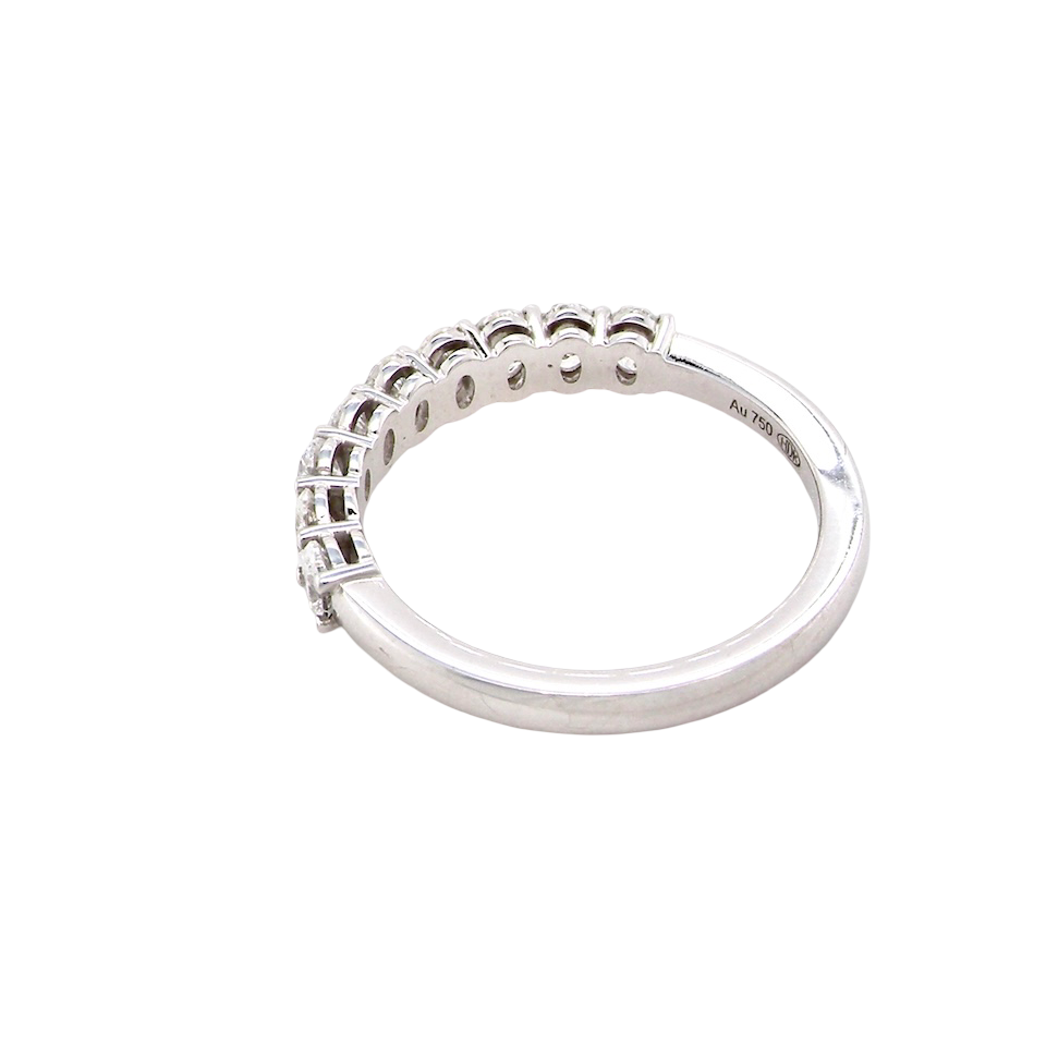 rear gorgeous half-hoop eternity ring set with nine oval brilliant-cut white diamonds.