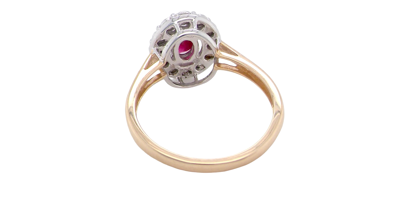 rear oval ruby measuring 6x4mm (approx. 0.44 carats) in a raspberry red hue. The centre stone is accented by a halo of twelve white diamonds