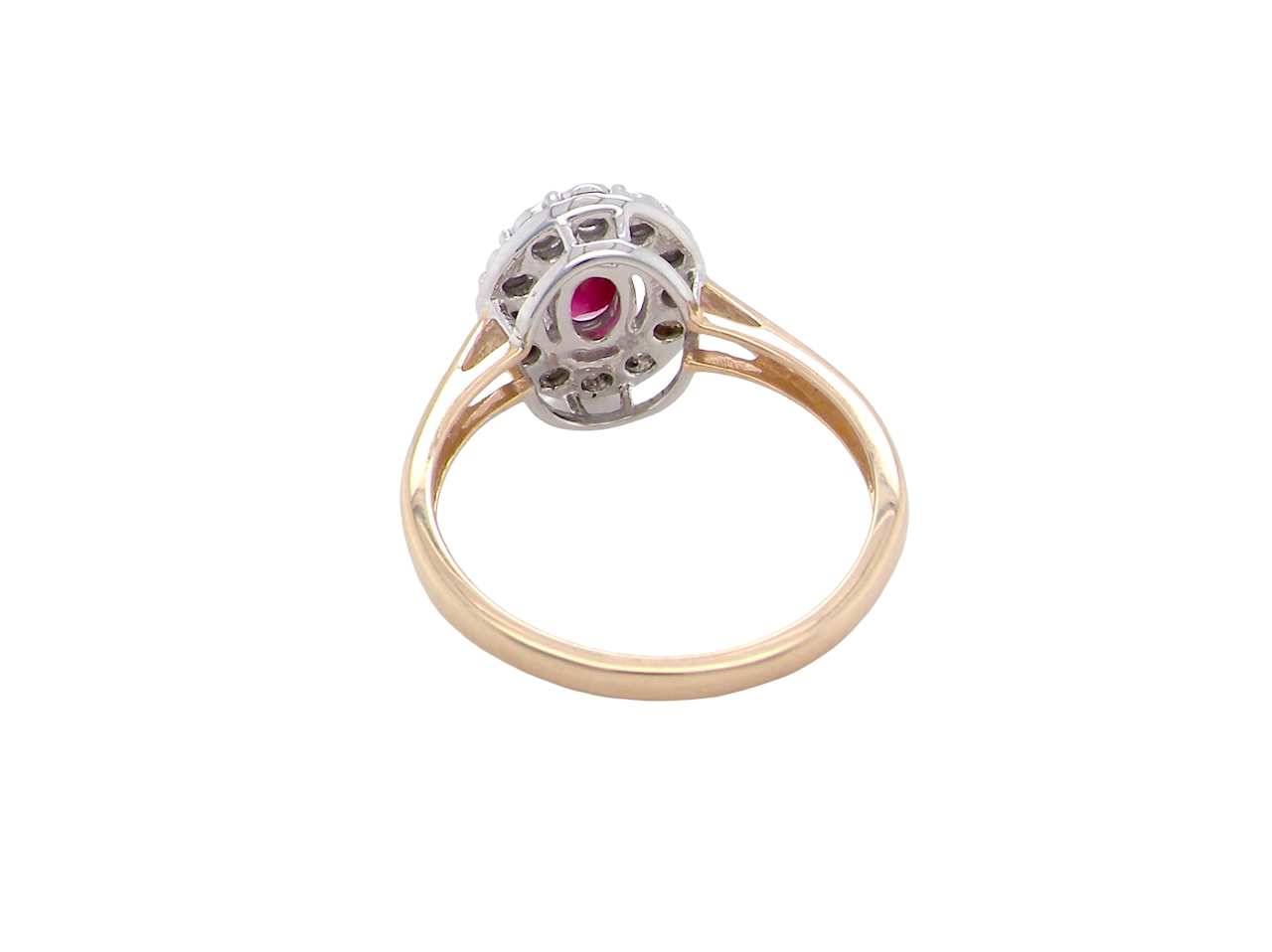 rear oval ruby measuring 6x4mm (approx. 0.44 carats) in a raspberry red hue. The centre stone is accented by a halo of twelve white diamonds