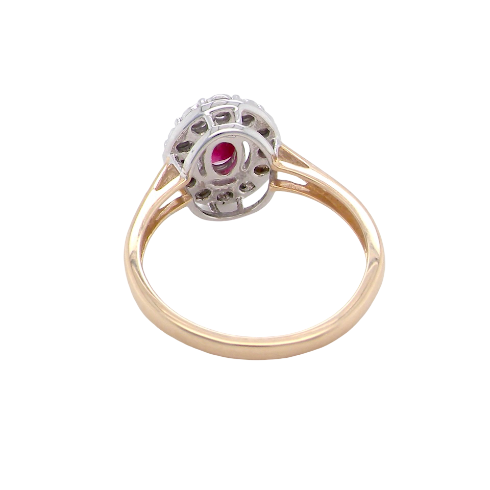 rear oval ruby measuring 6x4mm (approx. 0.44 carats) in a raspberry red hue. The centre stone is accented by a halo of twelve white diamonds