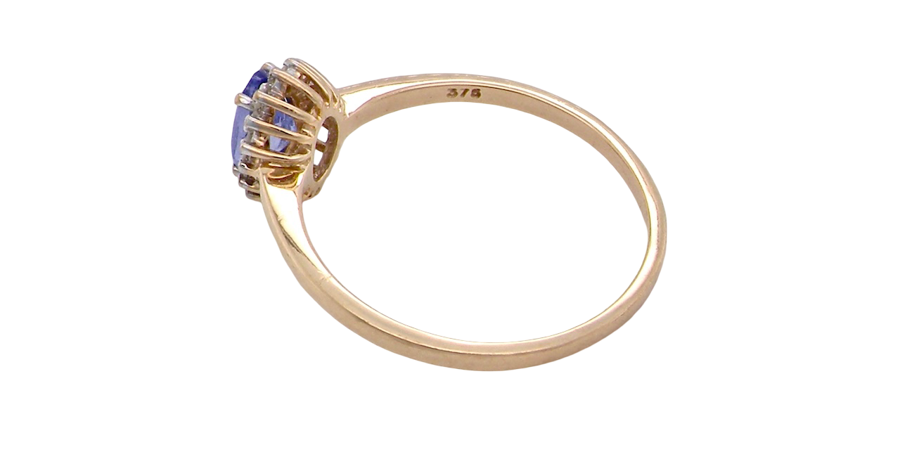 rear pretty cluster ring that features an oval cut tanzanite gemstone,