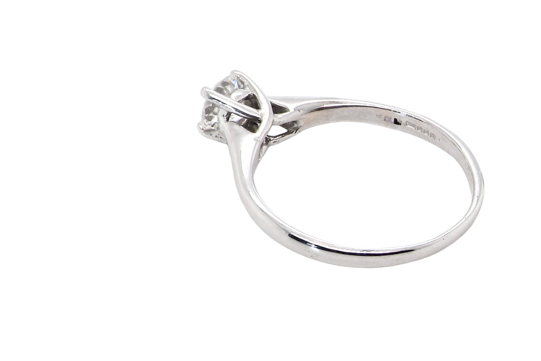 rear solitaire ring containing a fine modern brilliant cut white diamond. Measures 5.4mm (.53 carats)
Colour G-h, clarity Si. Modern feature under setting, depth 6.8mm, weight 2.6grams.