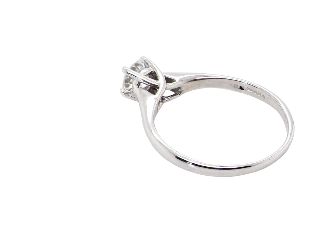 rear solitaire ring containing a fine modern brilliant cut white diamond. Measures 5.4mm (.53 carats)
Colour G-h, clarity Si. Modern feature under setting, depth 6.8mm, weight 2.6grams.