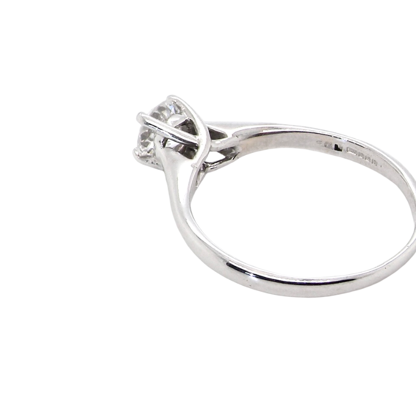 rear solitaire ring containing a fine modern brilliant cut white diamond. Measures 5.4mm (.53 carats)
Colour G-h, clarity Si. Modern feature under setting, depth 6.8mm, weight 2.6grams.