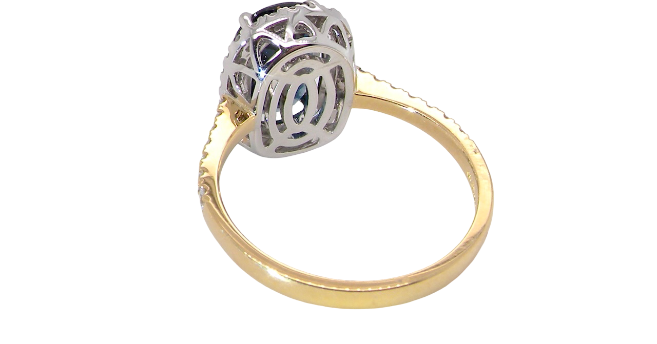 rear striking cluster ring featuring a captivating ink-black blue sapphire,
