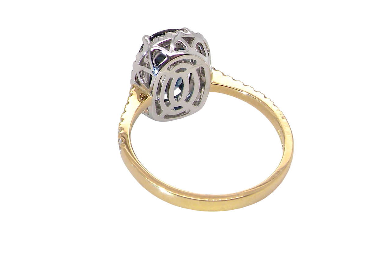 rear striking cluster ring featuring a captivating ink-black blue sapphire,