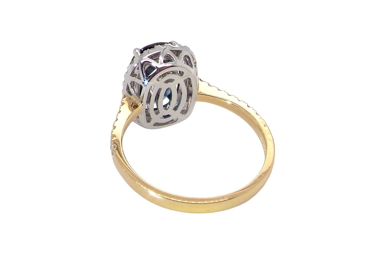 rear striking cluster ring featuring a captivating ink-black blue sapphire,