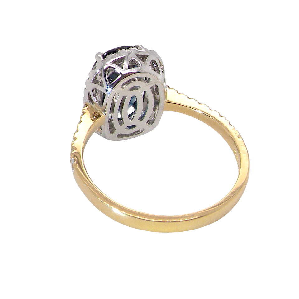 rear striking cluster ring featuring a captivating ink-black blue sapphire,