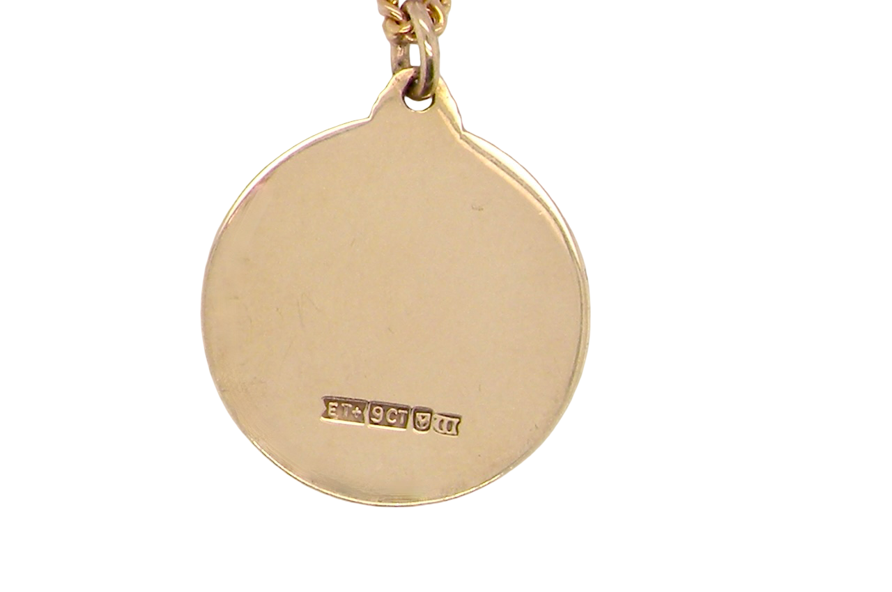reverse A 9 carat gold St Christopher (Patron Saint of Travellers) pendant.