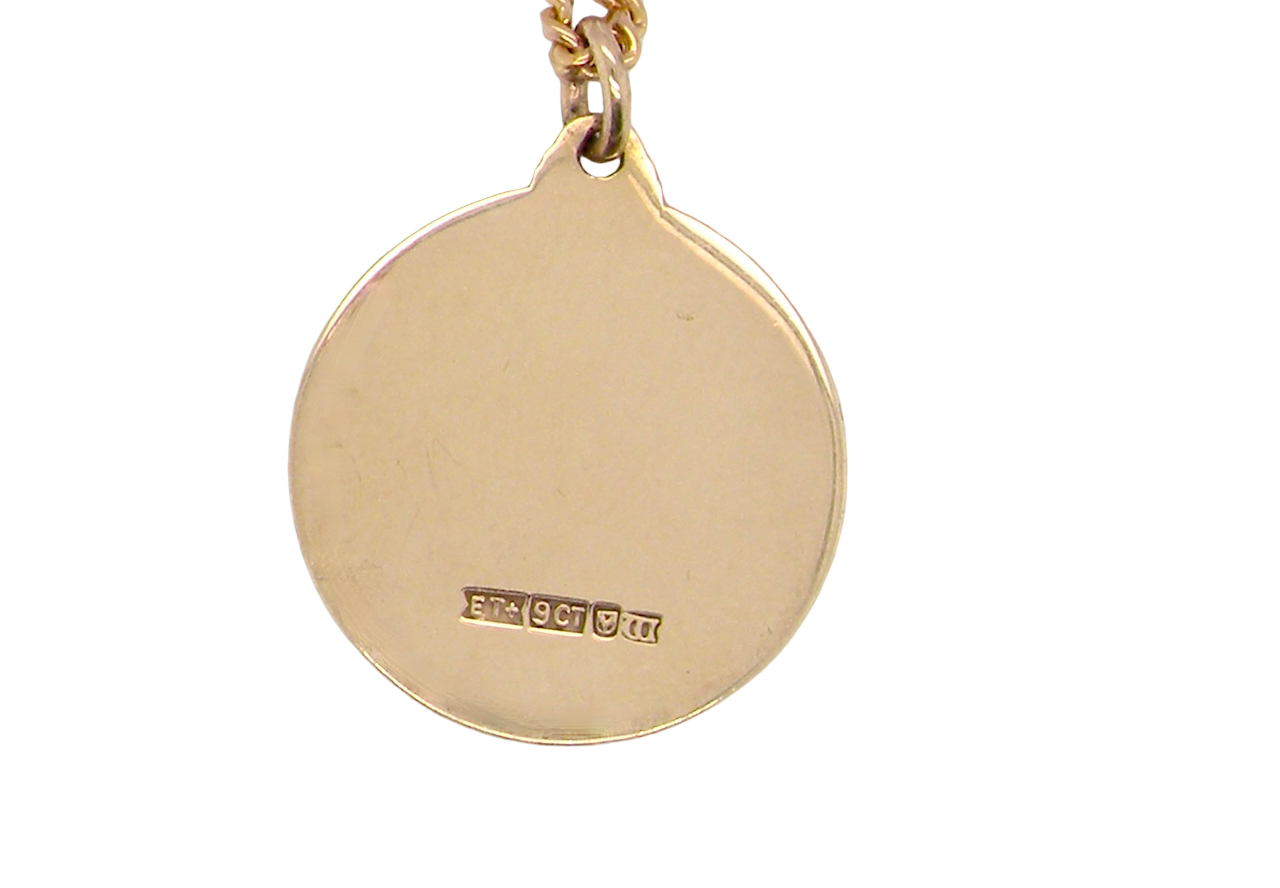 reverse A 9 carat gold St Christopher (Patron Saint of Travellers) pendant.