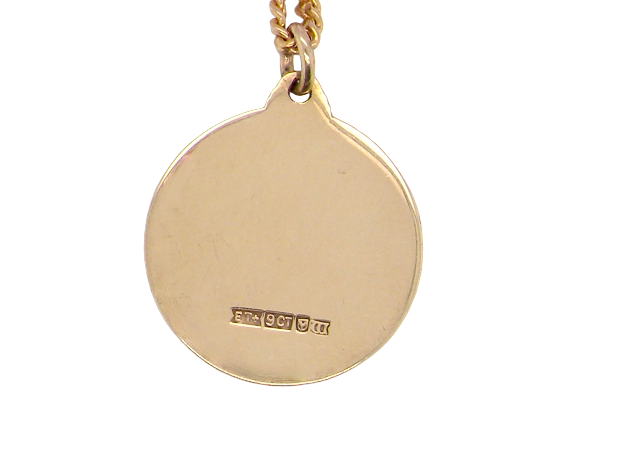 reverse A 9 carat gold St Christopher (Patron Saint of Travellers) pendant.
