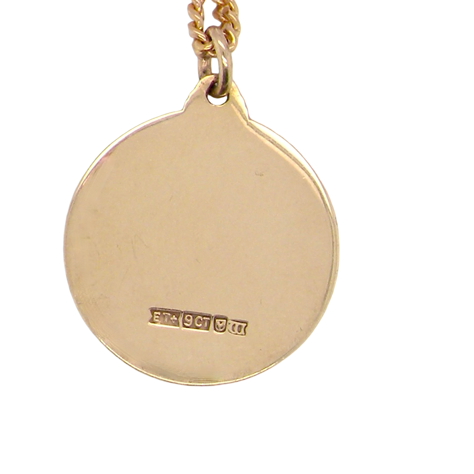 reverse A 9 carat gold St Christopher (Patron Saint of Travellers) pendant.