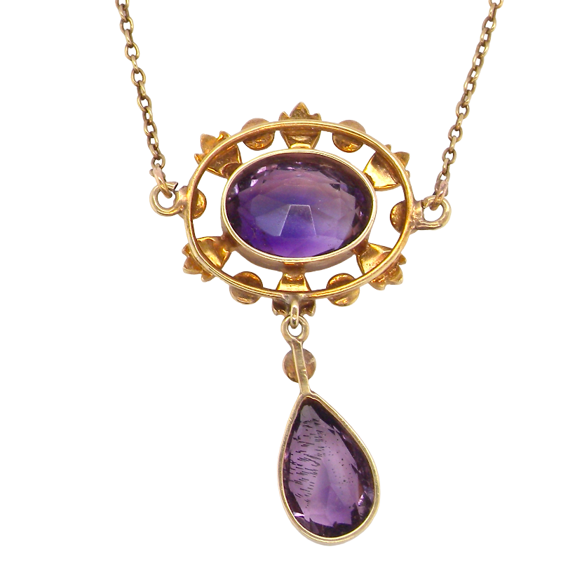 reverse An elegant pendant from the late part of the 19th century. This Victorian pendant features two luxurious amethyst gemstones,
