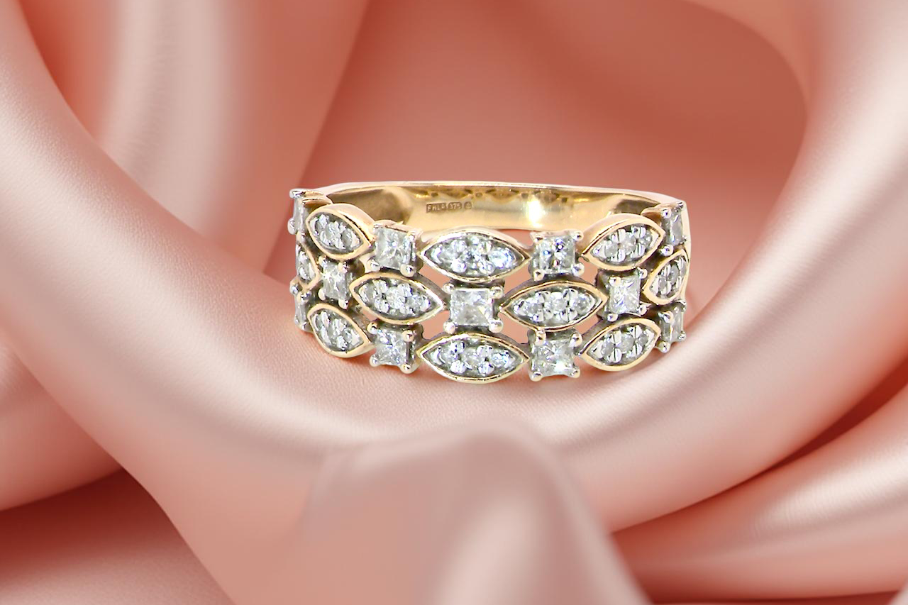 ring featuring three diamond-set bands