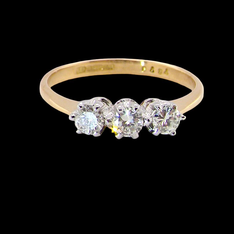 ring is set with three brilliant cut white diamonds, each 3mm diameter. (total estimated at 0.30 carats) Colour h-j, clarity Si.