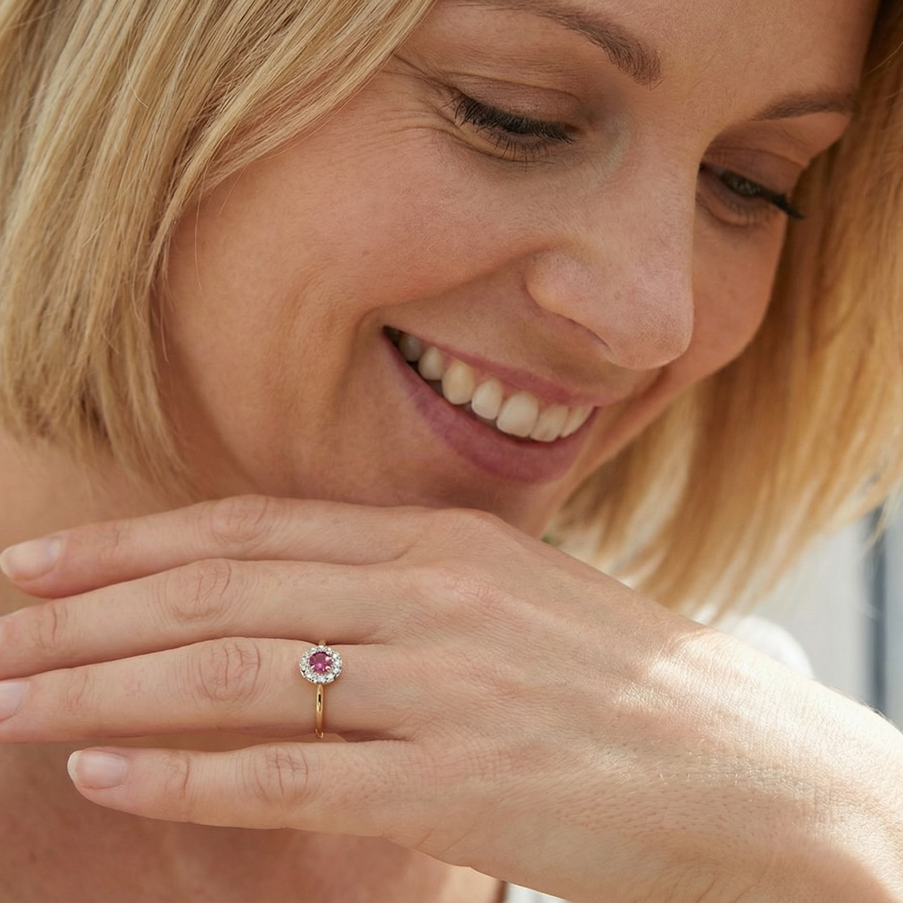 she loves A lovely daisy cluster ring that profiles to the centre a deep red ruby, 5mm (0.50 carats) yellow claw set.