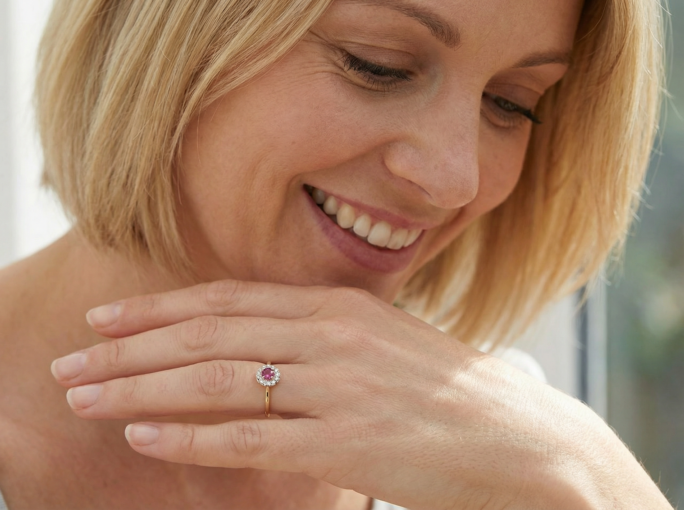 she loves A lovely daisy cluster ring that profiles to the centre a deep red ruby, 5mm (0.50 carats) yellow claw set.