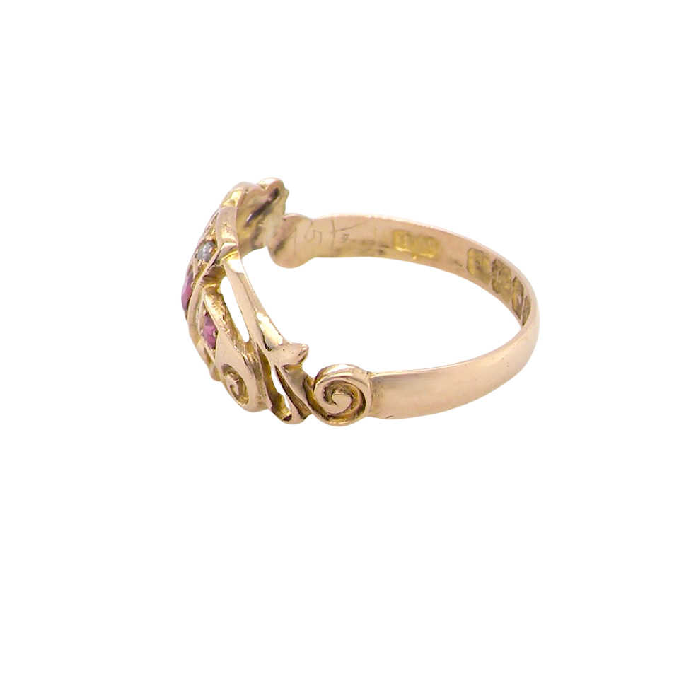 side An early 20th century ring. 18 carat gold, set with three rubies. 