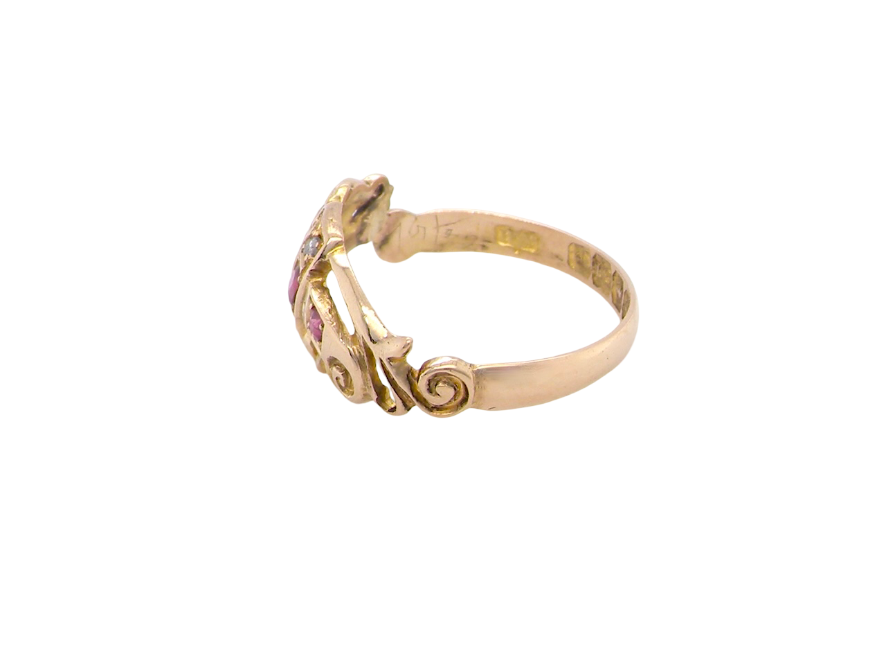 side An early 20th century ring. 18 carat gold, set with three rubies. 