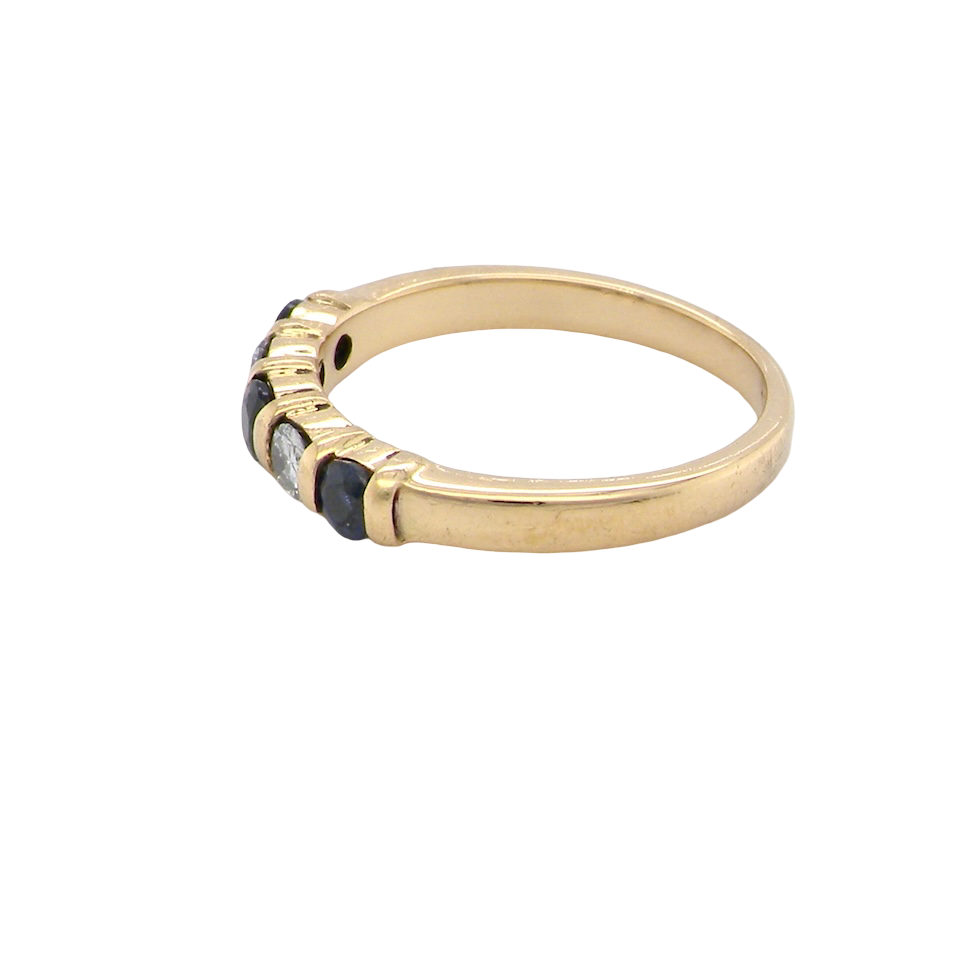 side 18-carat gold half-hoop eternity ring, set with three round mid-blue sapphires
