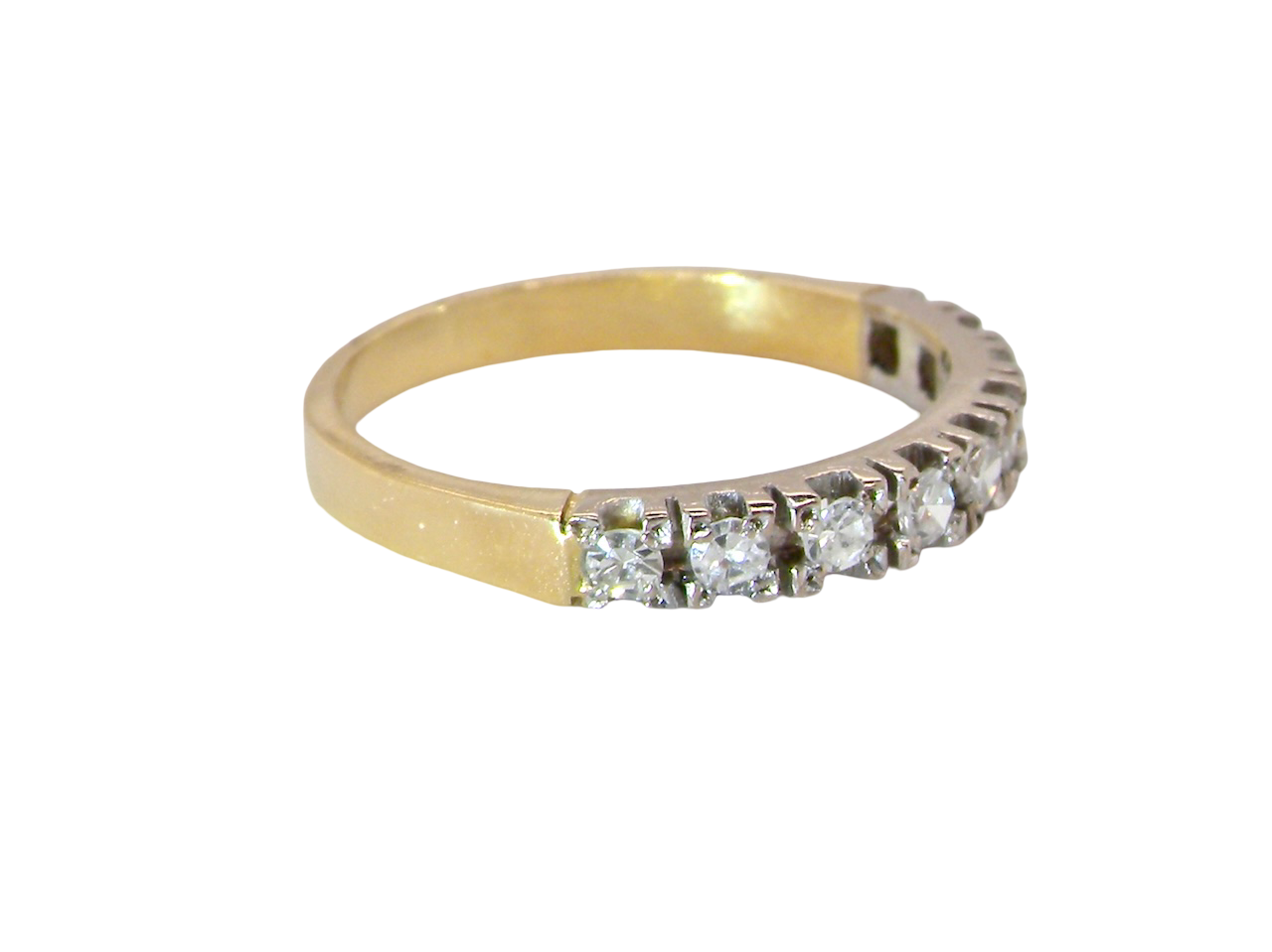 side 1970s vintage half-hoop eternity ring, tested as 18 carat gold and elegantly set with nine brilliant-cut white diamonds.