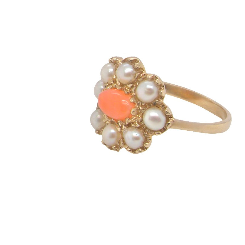 side. A 9 carat gold cluster ring. Centre stone an oval shaped coral stone 6x4mm.
