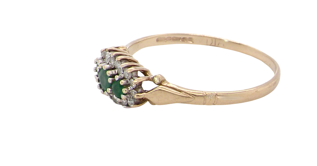 side A 9 carat gold cluster ring. Set to the centre three round emeralds, centre 3.2mm, each side a 2.6mm stone.