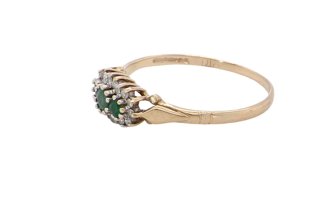 side A 9 carat gold cluster ring. Set to the centre three round emeralds, centre 3.2mm, each side a 2.6mm stone.