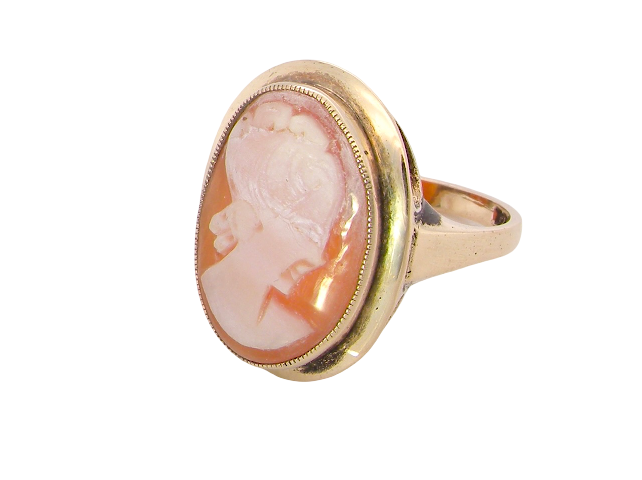 side A 9 carat gold dress ring that features a cameo shell. Carved with the head of a young woman. Measures 20x15mm.