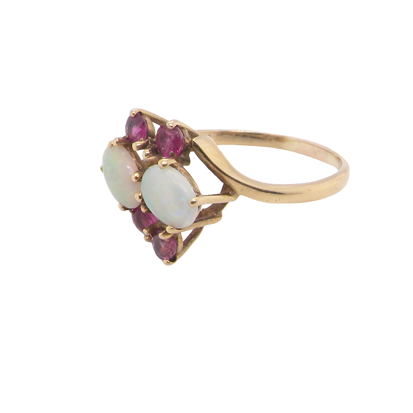 side A 9 carat gold dress ring that features two oval white opals, each 7x5mm, and four rubies each 3.4mm.