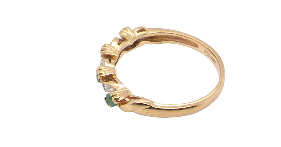 side A 9 carat gold half hoop eternity ring. Set with four 2.4mm emeralds.
Set in alternate sections, a 'lazy S' design,