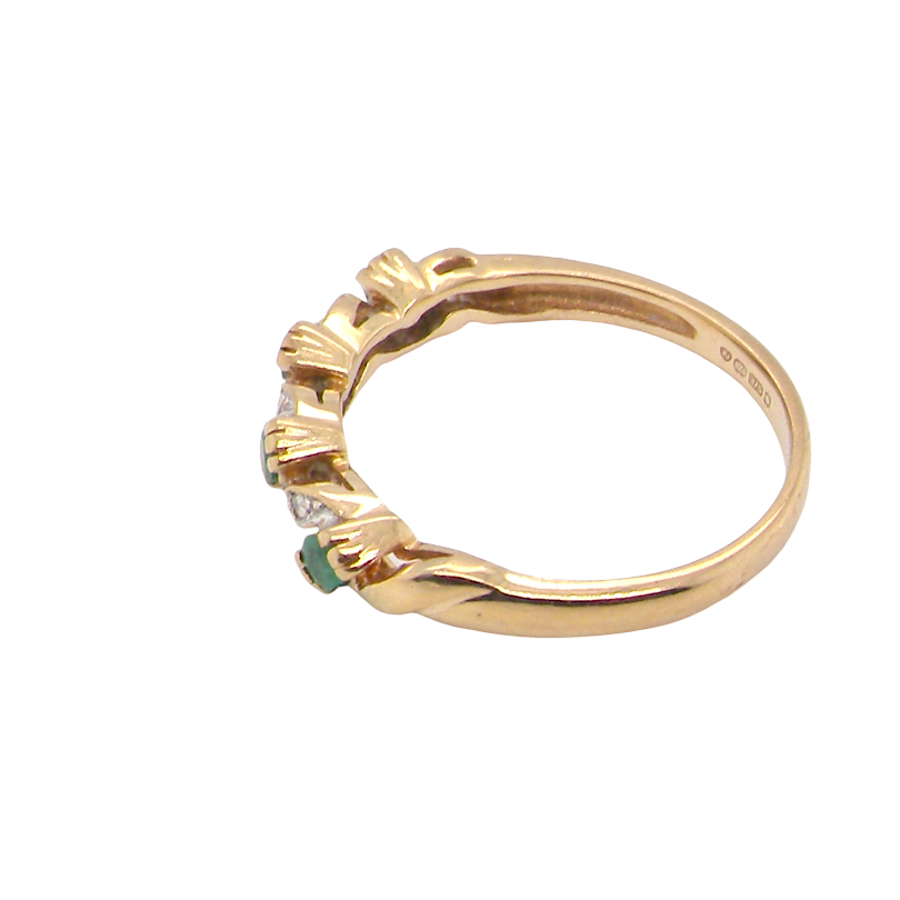 side A 9 carat gold half hoop eternity ring. Set with four 2.4mm emeralds.
Set in alternate sections, a 'lazy S' design,