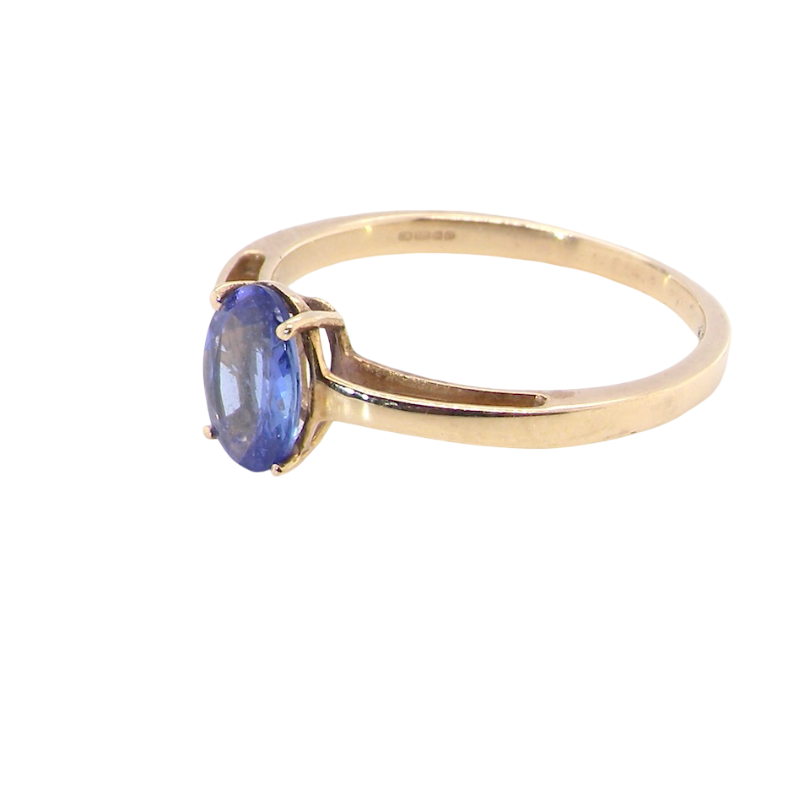 side A 9 carat gold ring containing a single oval cut tanzanite gemstone. Measures 8x6mm, four claw setting.