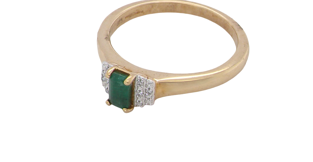 side A 9 carat gold ring that features a rectangular cut emerald, 5x3mm (est 0.30 carats)