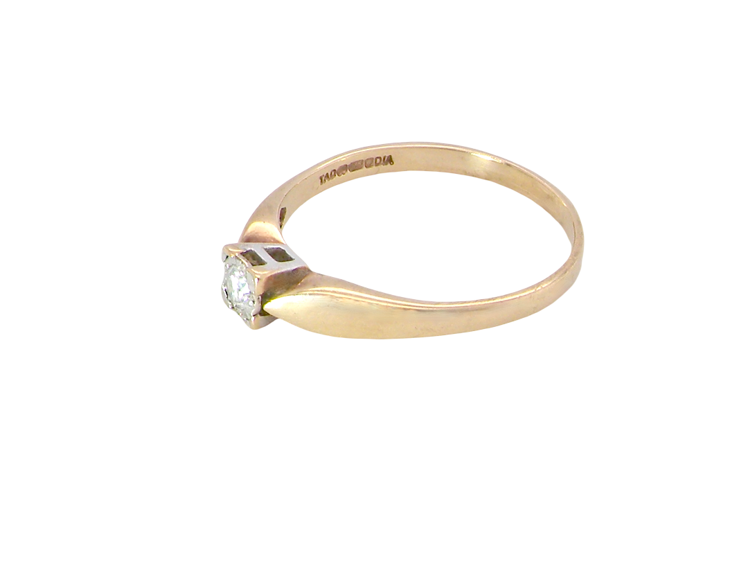 side A 9 carat gold solitaire ring. Features a single white diamond 3.4mm (est 0.15 carats)