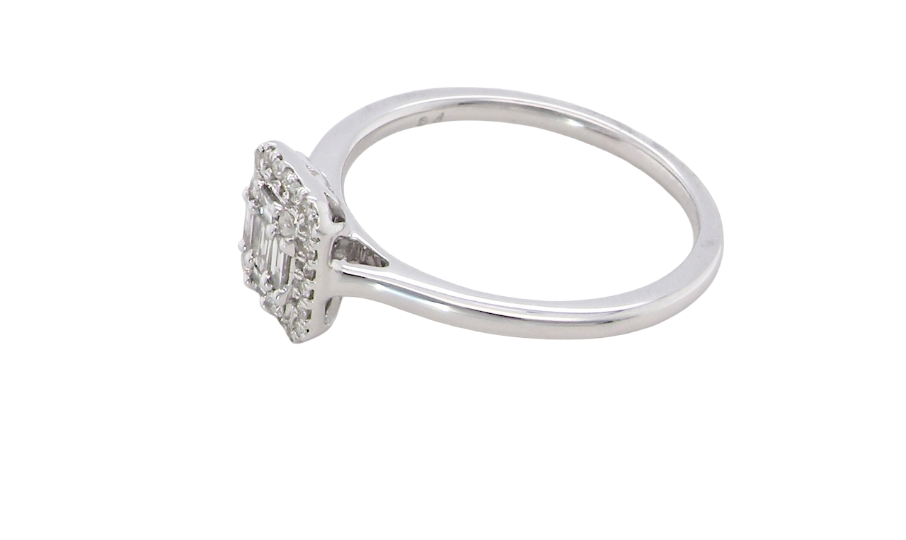 side A 9 carat white gold cluster ring. The centre is set with five baguette cut white diamonds, 3 x 2x1.2mm, 2 x 1mm.