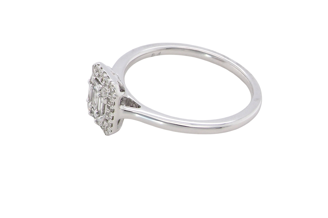 side A 9 carat white gold cluster ring. The centre is set with five baguette cut white diamonds, 3 x 2x1.2mm, 2 x 1mm.