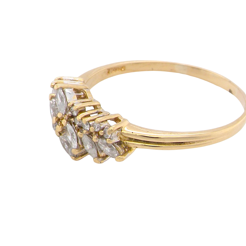 Gold ring with diamond-like stones on a white background
