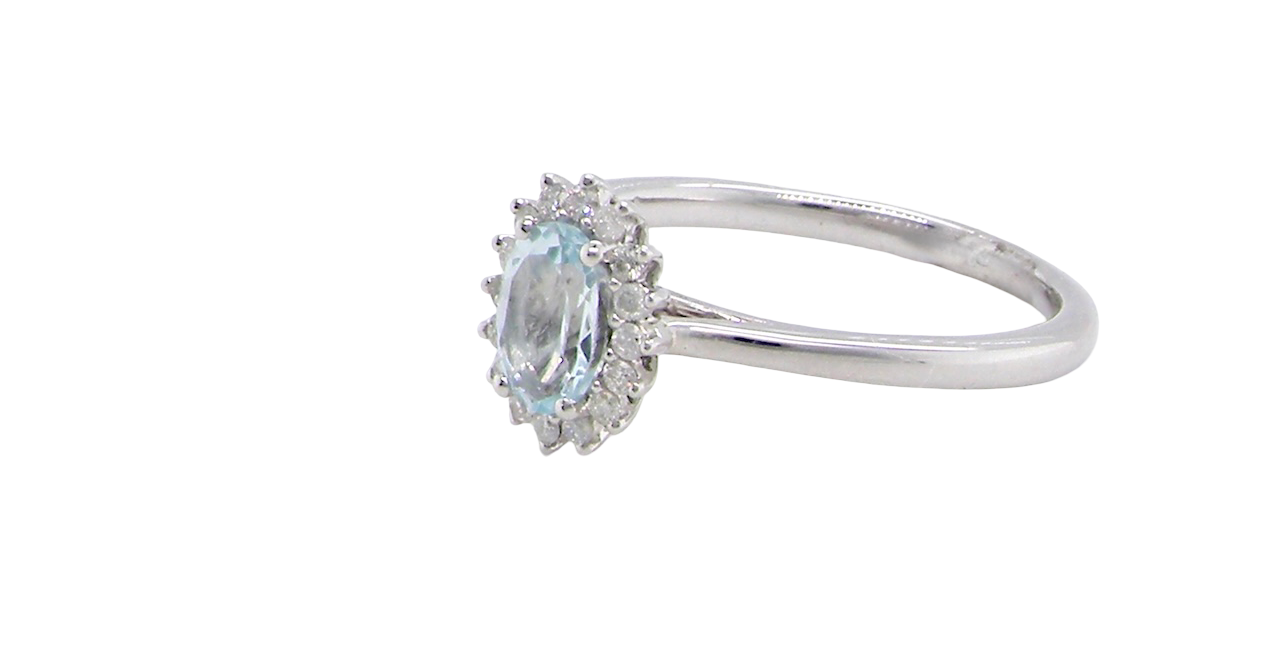 A NEW blue topaz and diamond ring