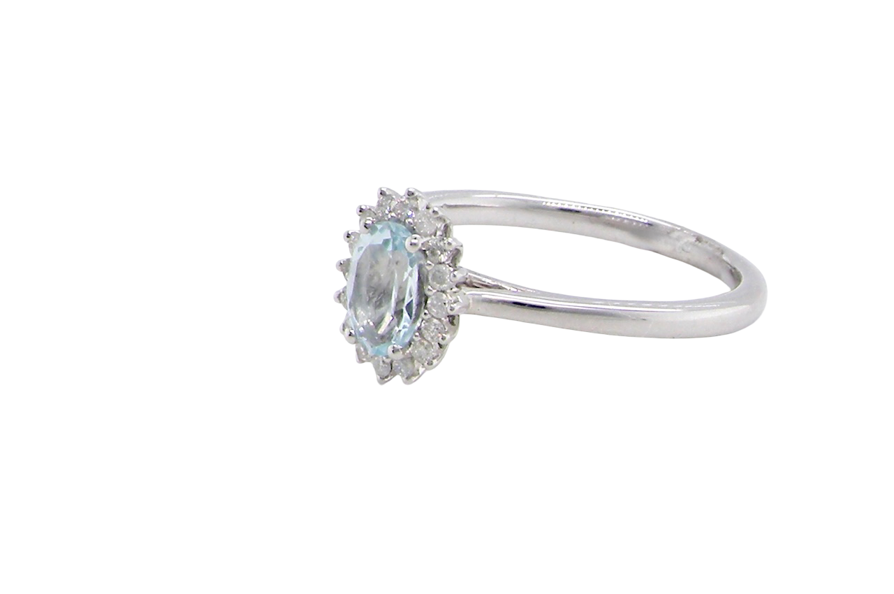 A NEW blue topaz and diamond ring