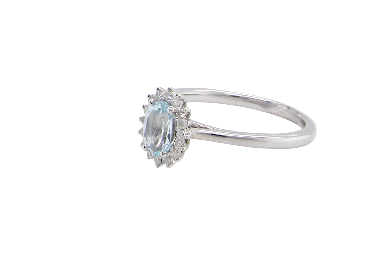 A NEW blue topaz and diamond ring