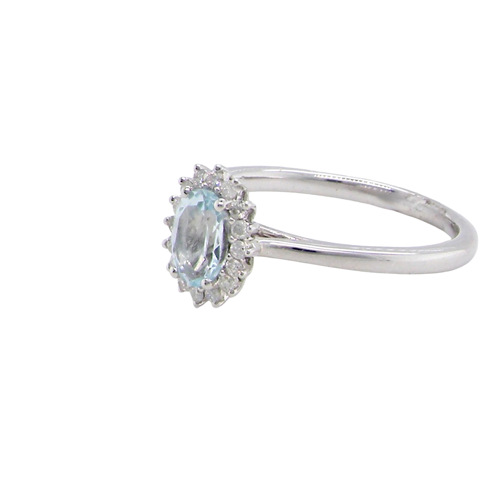 A NEW blue topaz and diamond ring